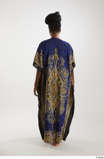 Dina Moses  1 back view dressed traditional decora long…